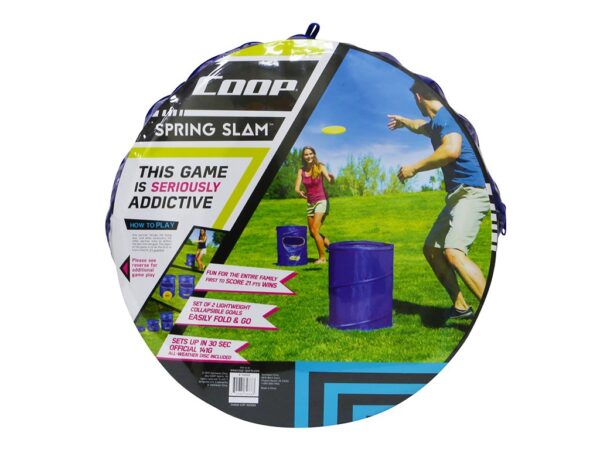 Two people play a frisbee game with blue barrels on grass. The packaging advertises it as "seriously addictive." Vibrant outdoor scene.